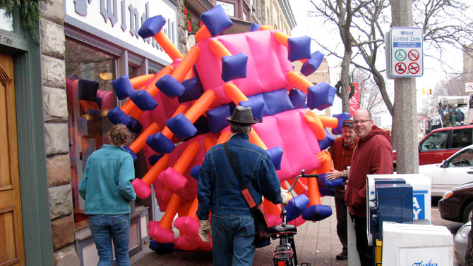Public art performance in an inflatable suit in downtown Holland, Michigan