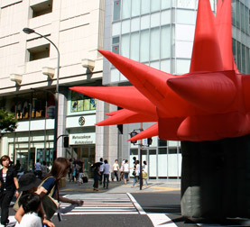 Inflatable suit standing in Japanese crosswalk