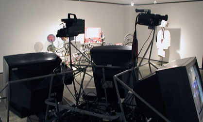 Looking over television sculpture in a solo show by James Kuehnle