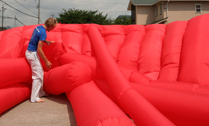 Kjell Hahn helps untangle a large inflatable for a test inflate