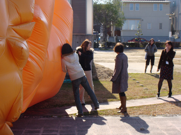 Viewers bounce against interactive inflatable art.