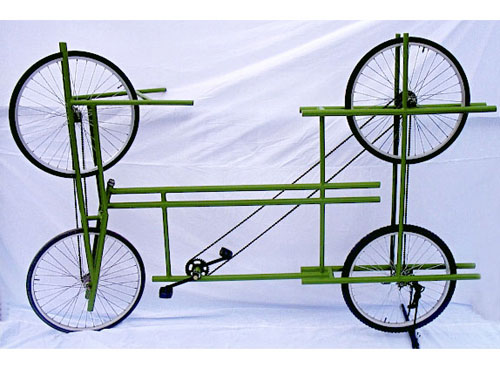 Custom bicycle with four wheels connected by chains.