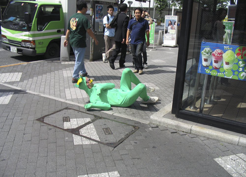 Jimmy Kuehnle rolls down the street in a Kappa suit in Tokyo, Japan.