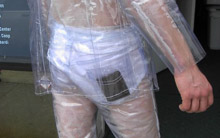 Clear vinyl suit showing wallet and underwear.